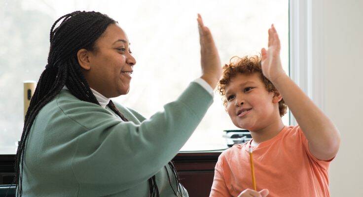 An executive functioning coach working with a student.